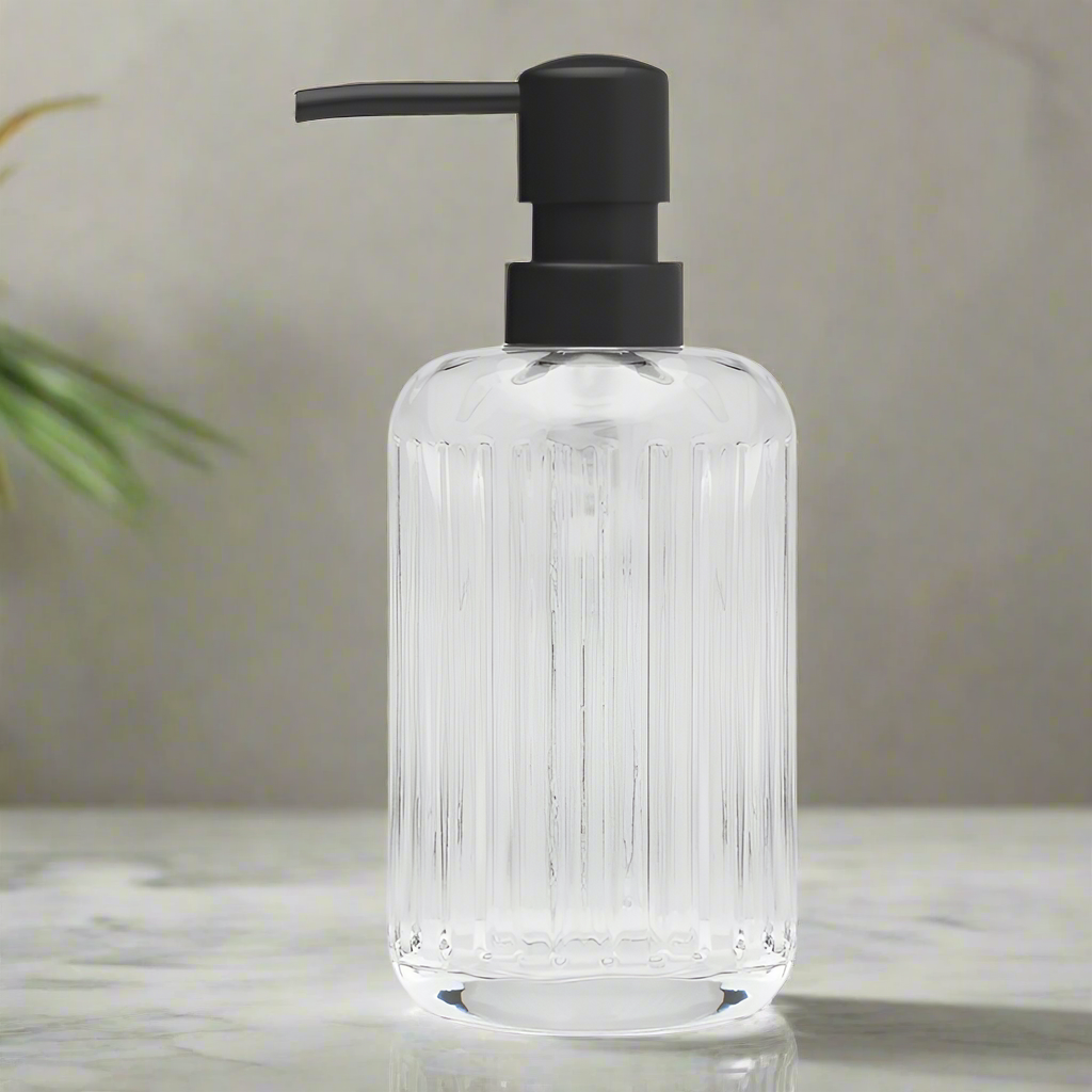 Clear glass soap dispenser with black pump from La Dolce Casa's Porto collection.