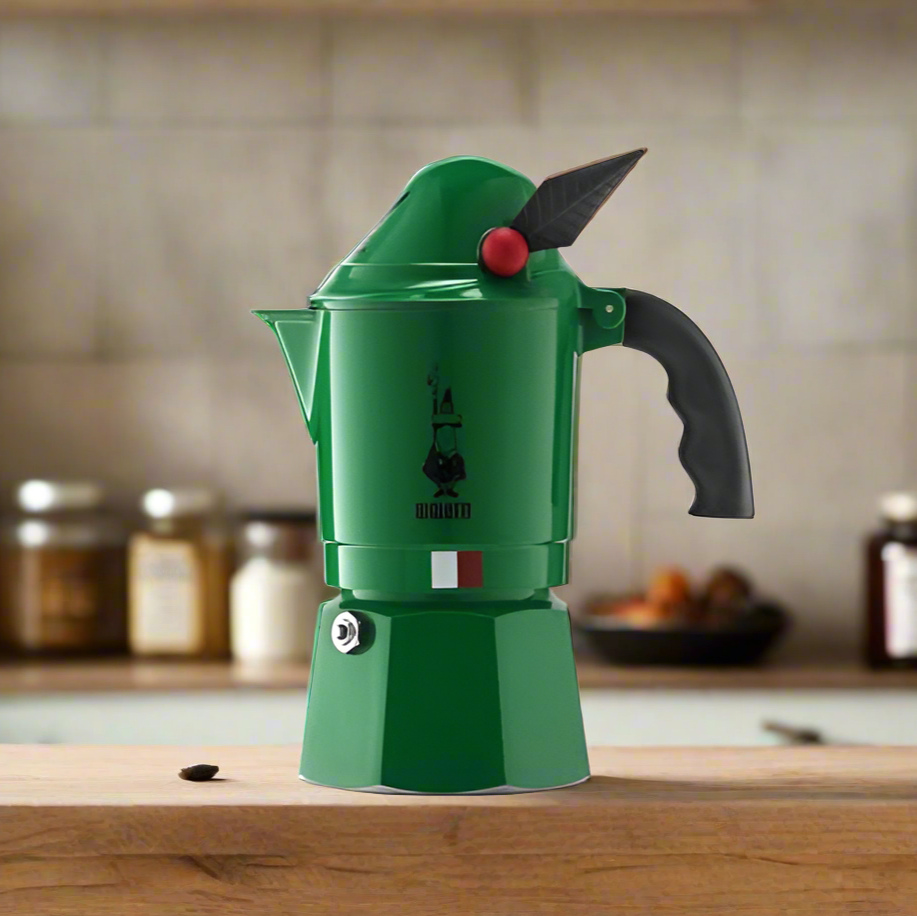 Bright green Bialetti Break Alpina 3-cup espresso maker on wooden kitchen counter